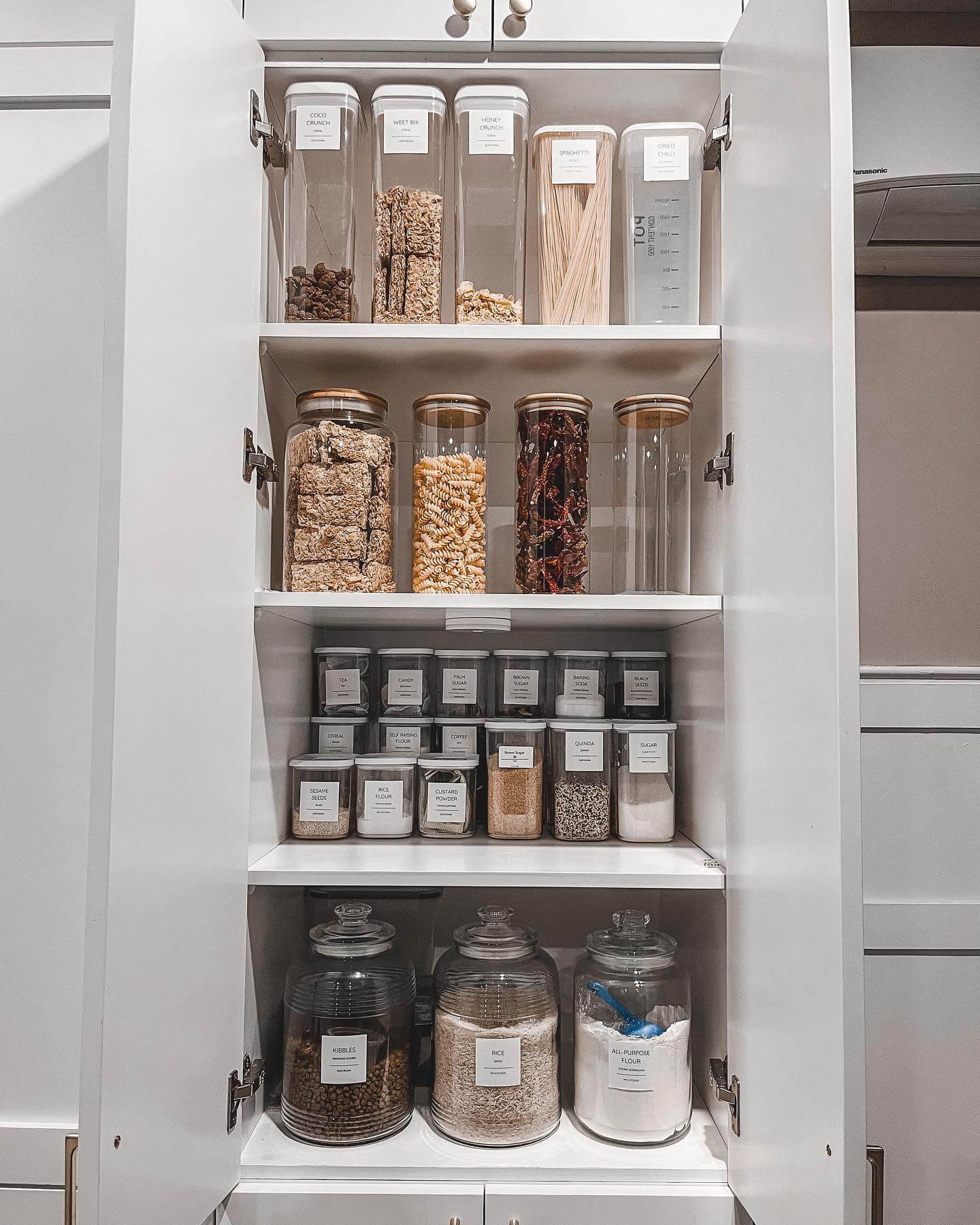 Glass Jars With Wood Lids Keep Cookies and Pasta Visible