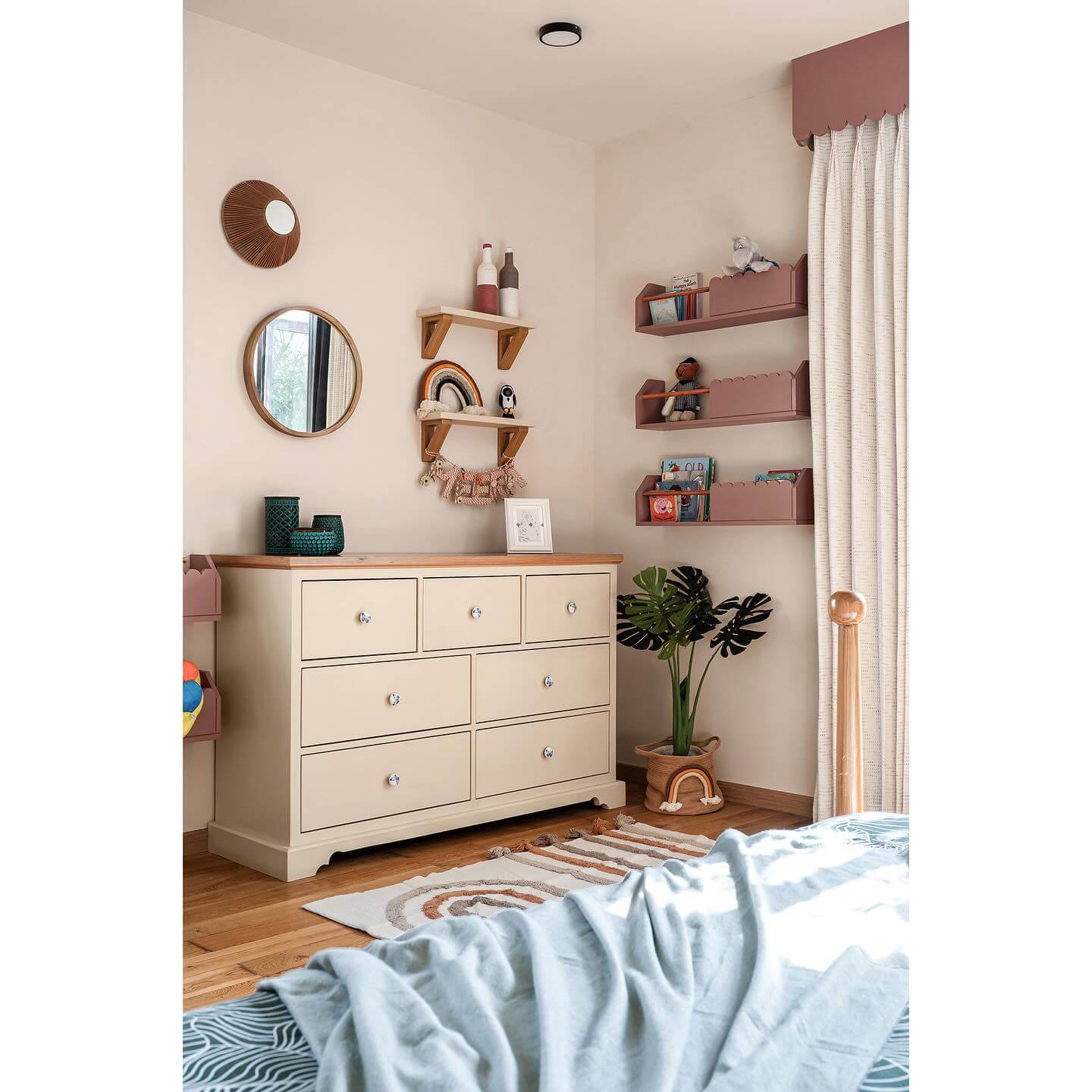Scalloped Pink Wall Shelves Organize Books and Toys