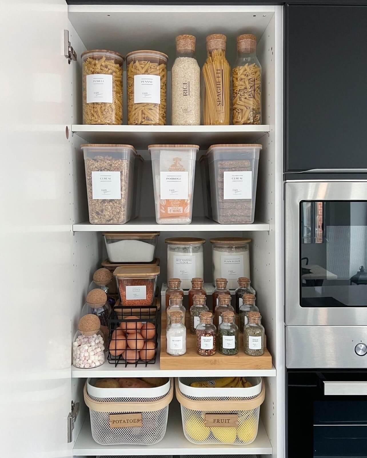 Tiered wooden riser displays spice jars neatly