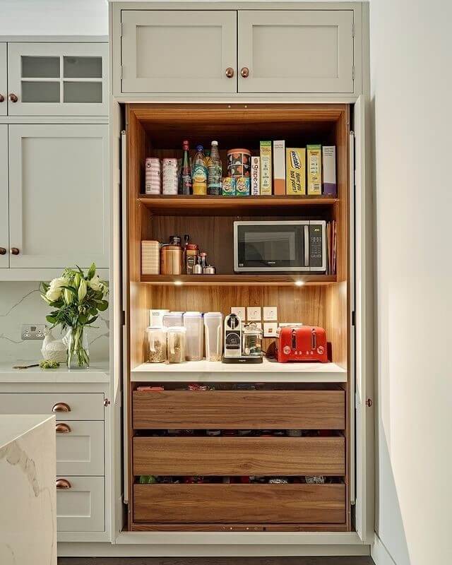 Deep wooden drawers organize pantry overflow items