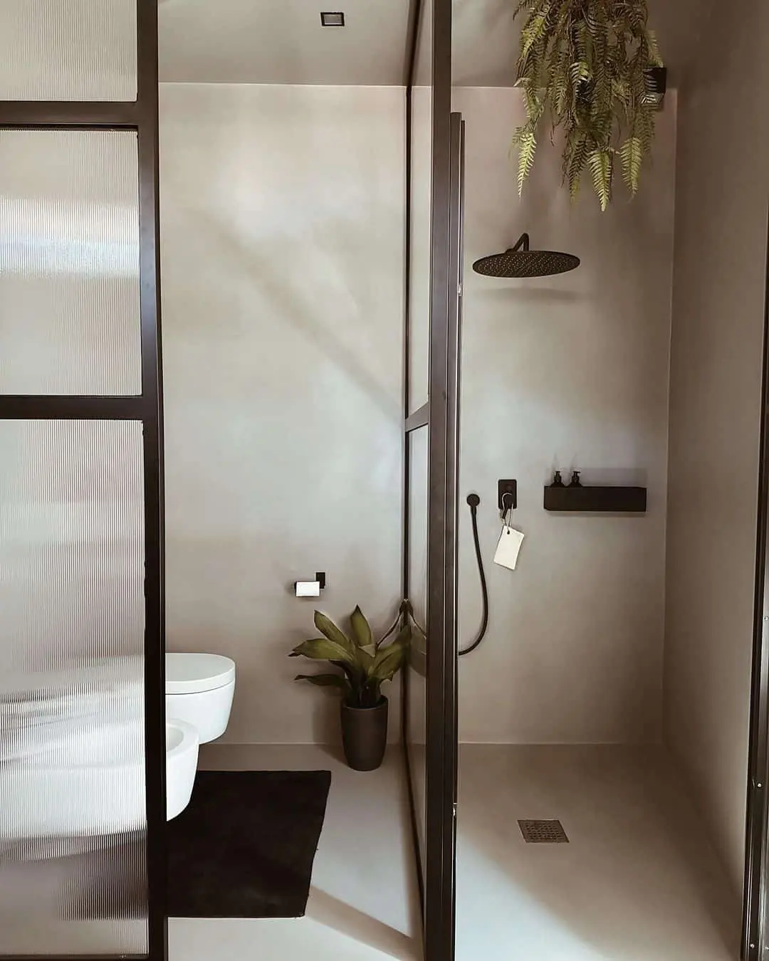 Monochromatic Concrete Walls for a Seamless Modern Shower