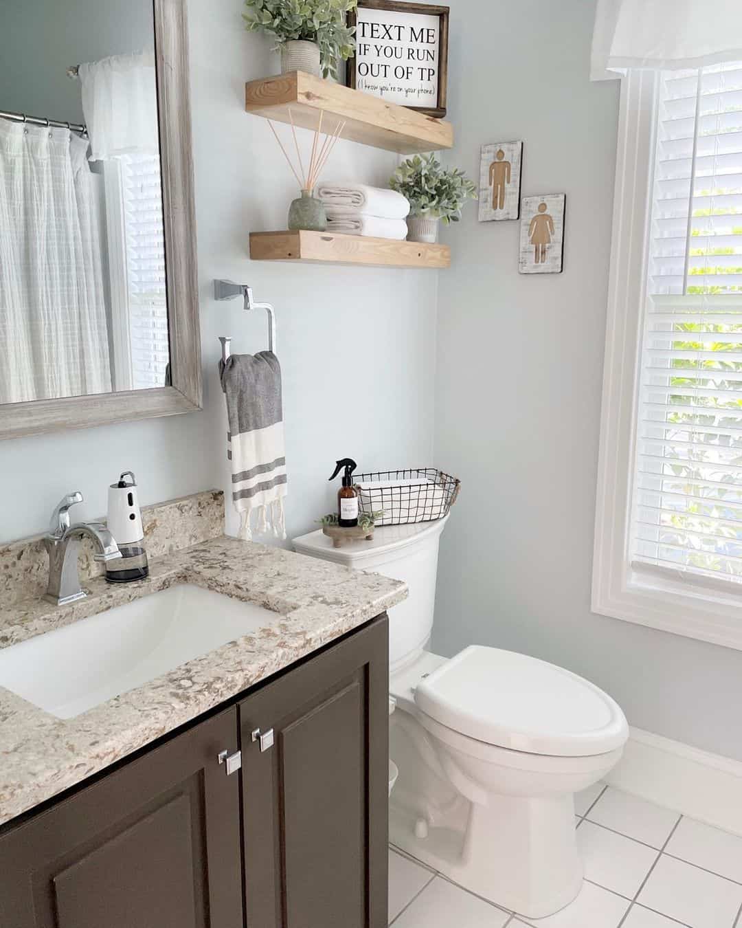 Natural Wood Shelves Add Warmth Above the Toilet