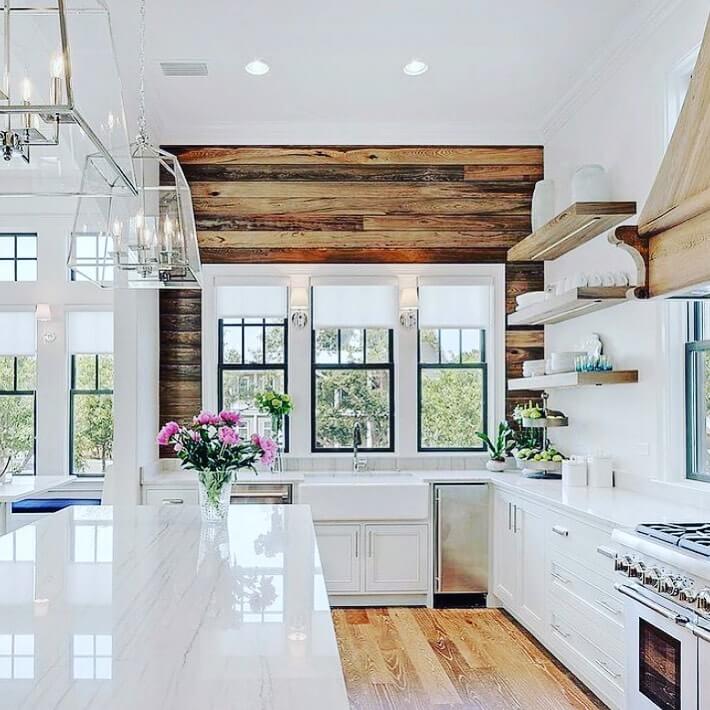 Reclaimed Wood Accent Wall Creates a Warm Backdrop for White Kitchen