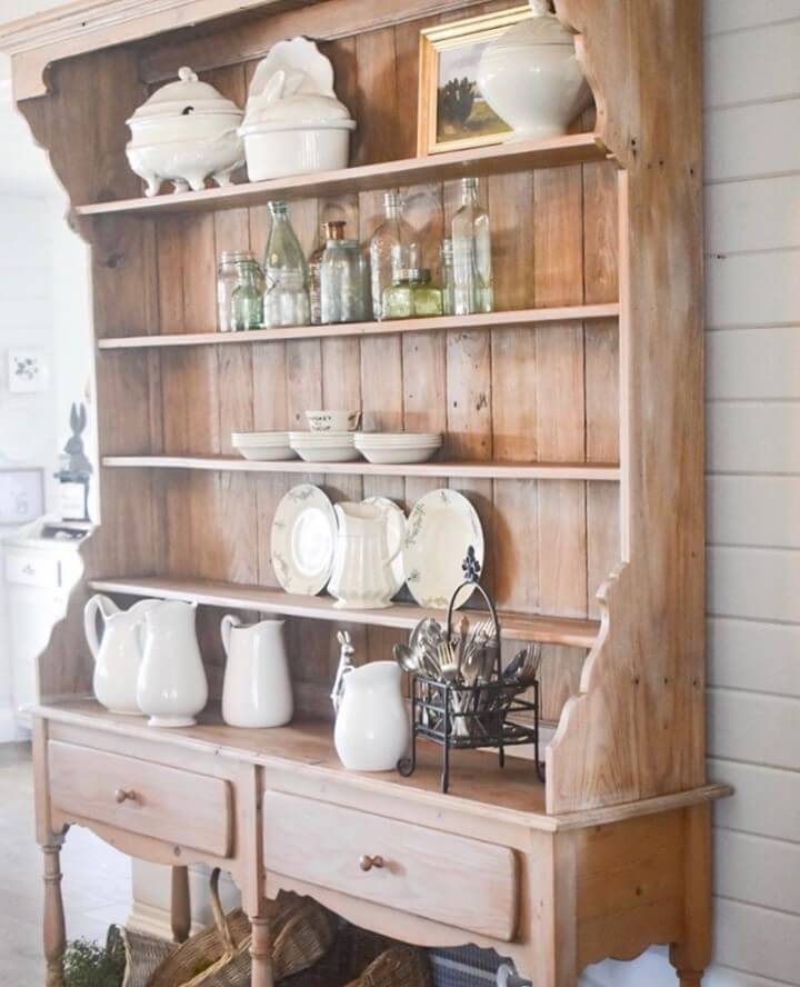 White Pitchers Line Up On Open Shelving