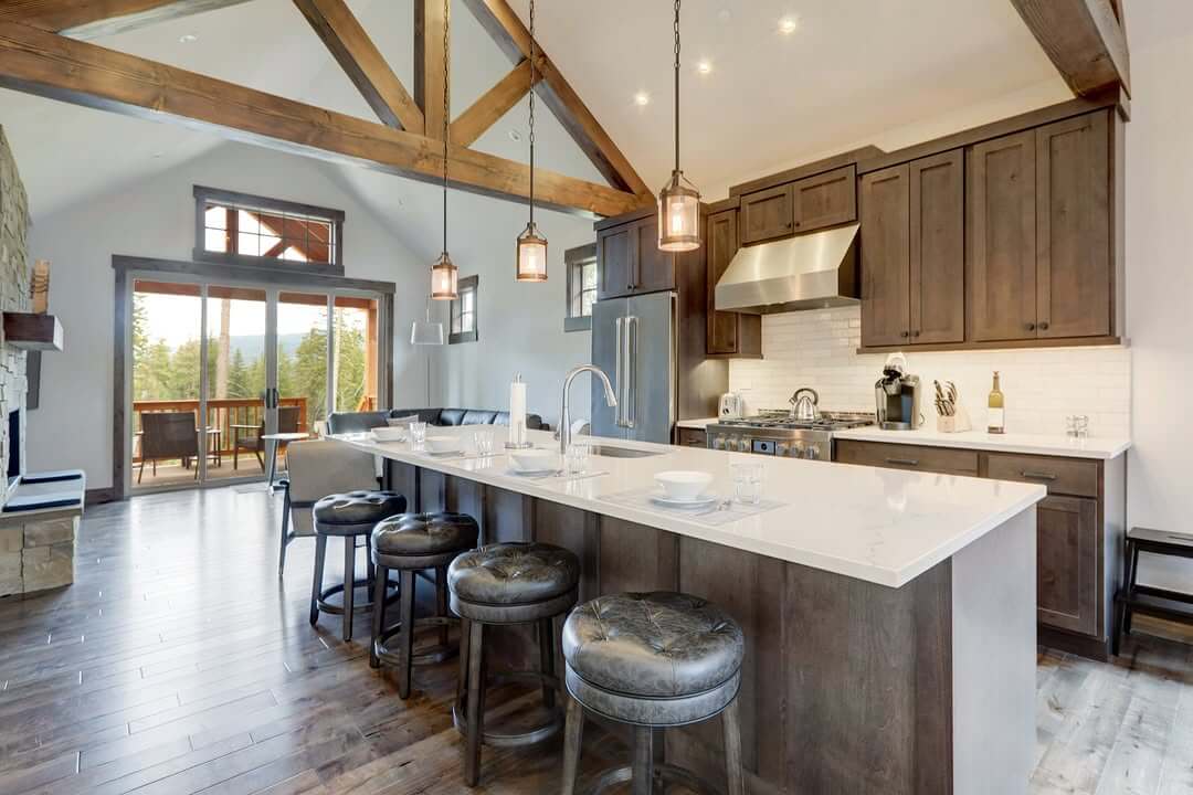 Dark Wood Island with Leather Stools Anchors Open Kitchen