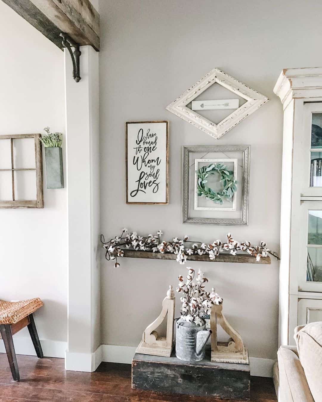 Gallery Wall Features Distressed Frames and Script Art