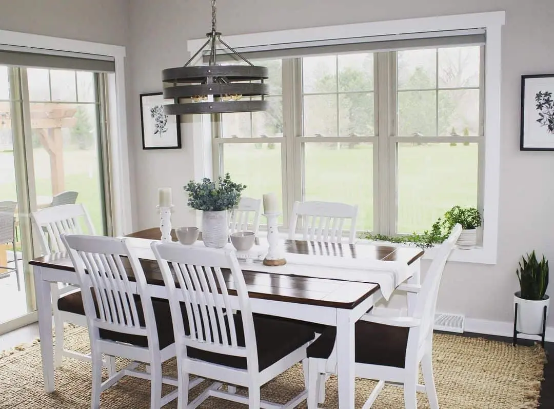 Contrast Dark Table with White Spindle-Back Chairs