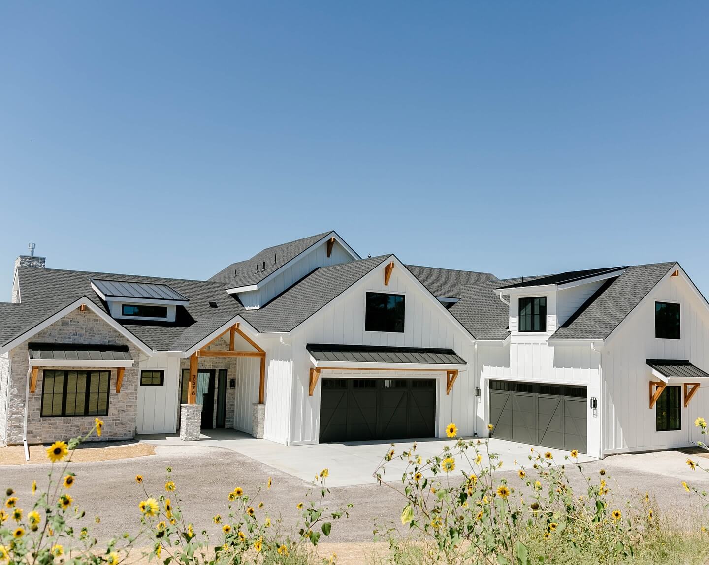 Stone and White Siding Create Textured Facade