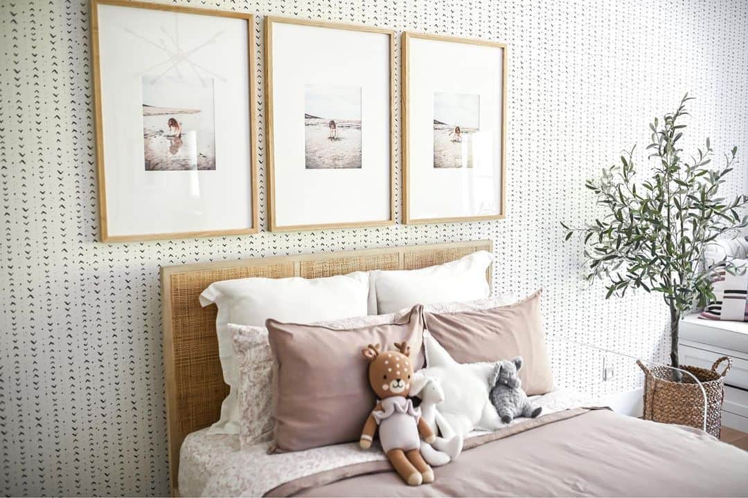 Framed Beach Triptych Above a Rattan Headboard