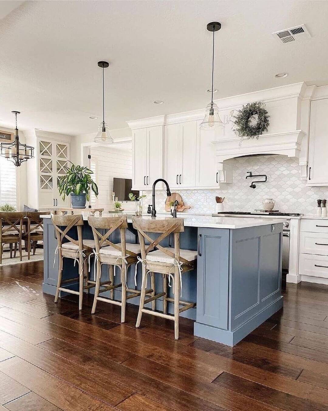 Dusty Blue Island with Warm Wood Stools and Flooring