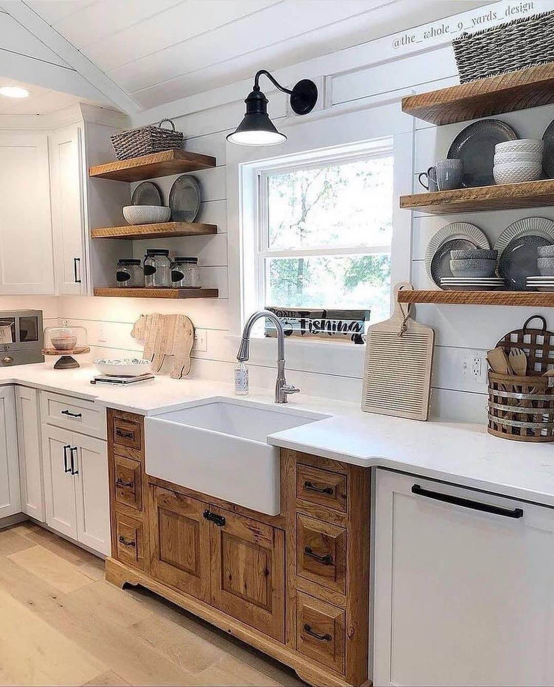 Natural Wood Cabinetry Around a White Farmhouse Sink