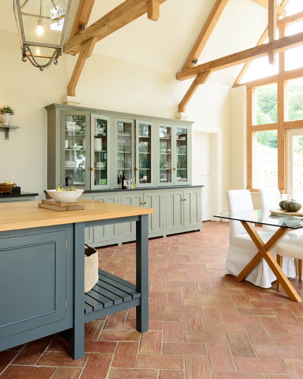 Sage Green Cabinetry with Glass Doors for Display