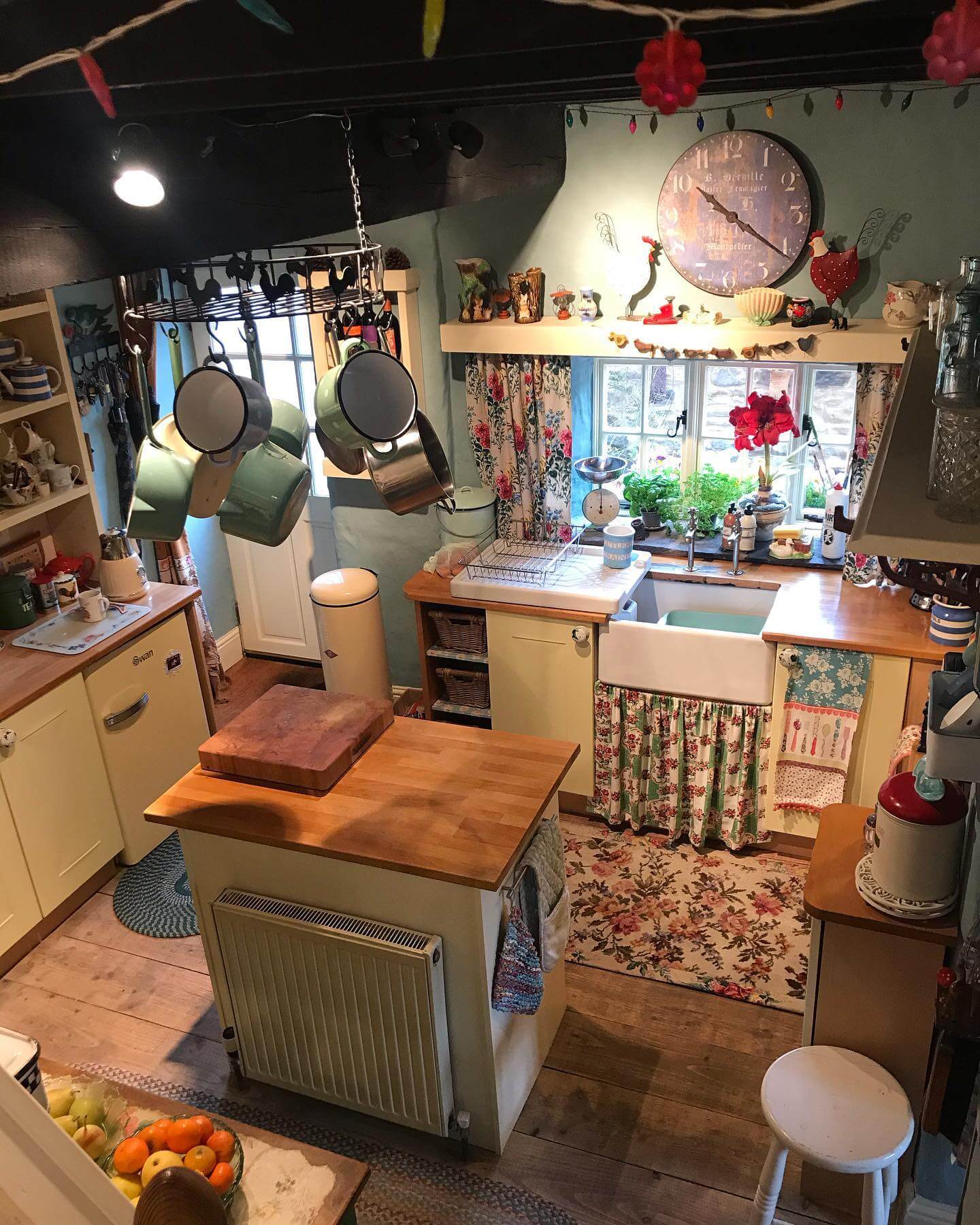 Hanging Pot Rack Creates Vertical Storage and Rustic Charm