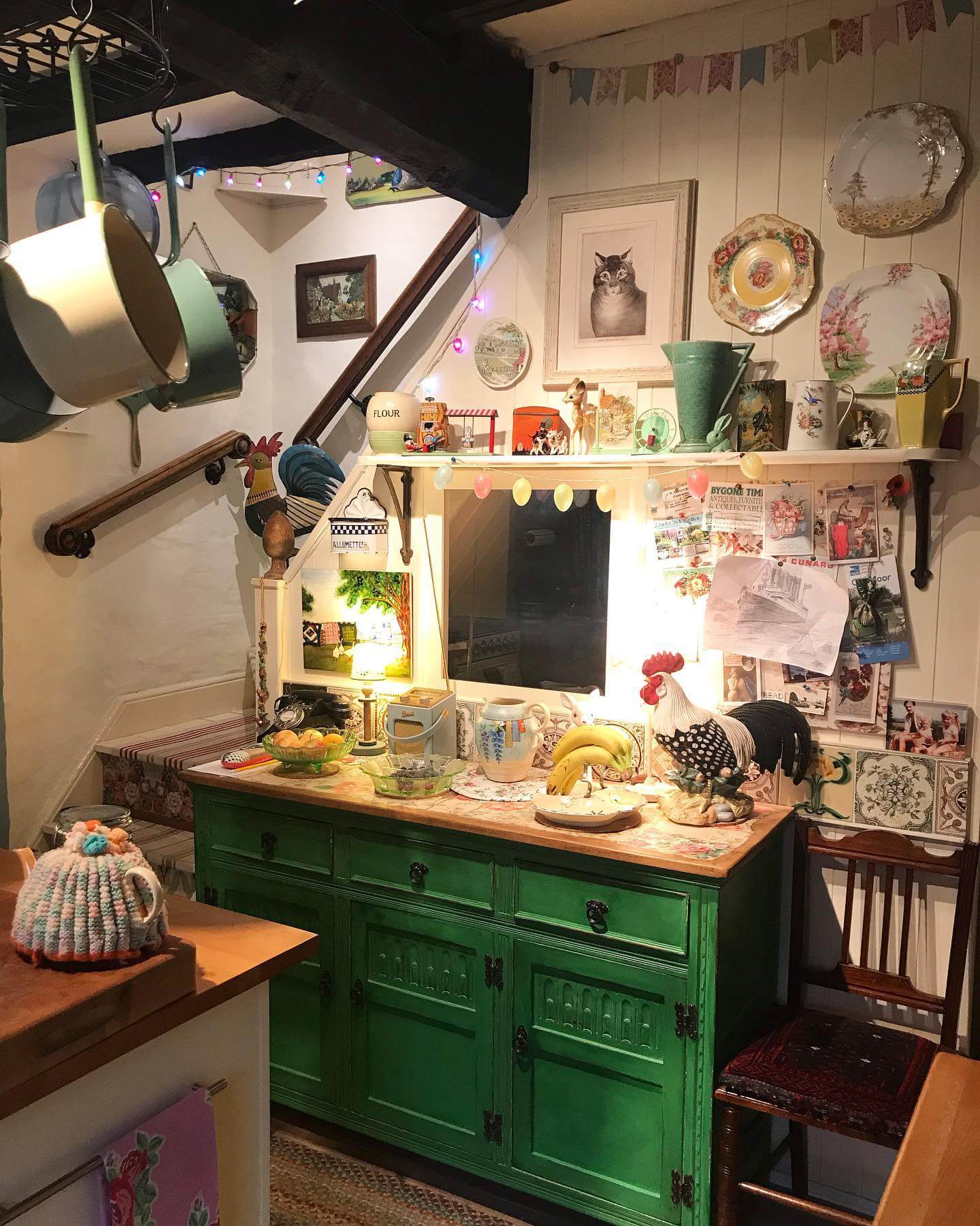 Green Dresser Adds a Pop of Color to Stairwell Nook