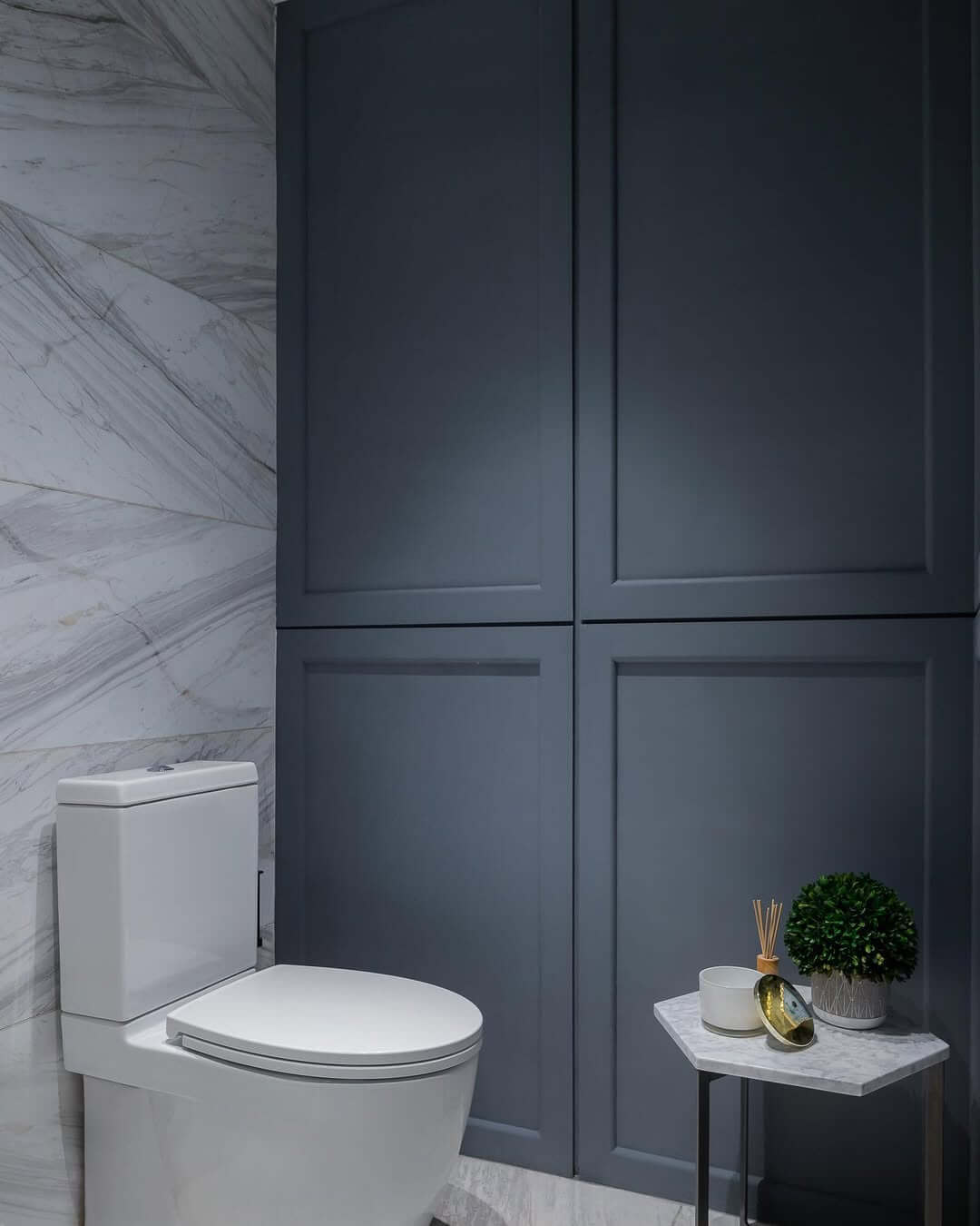 Dark Blue Cabinets Pair with Marble Accents