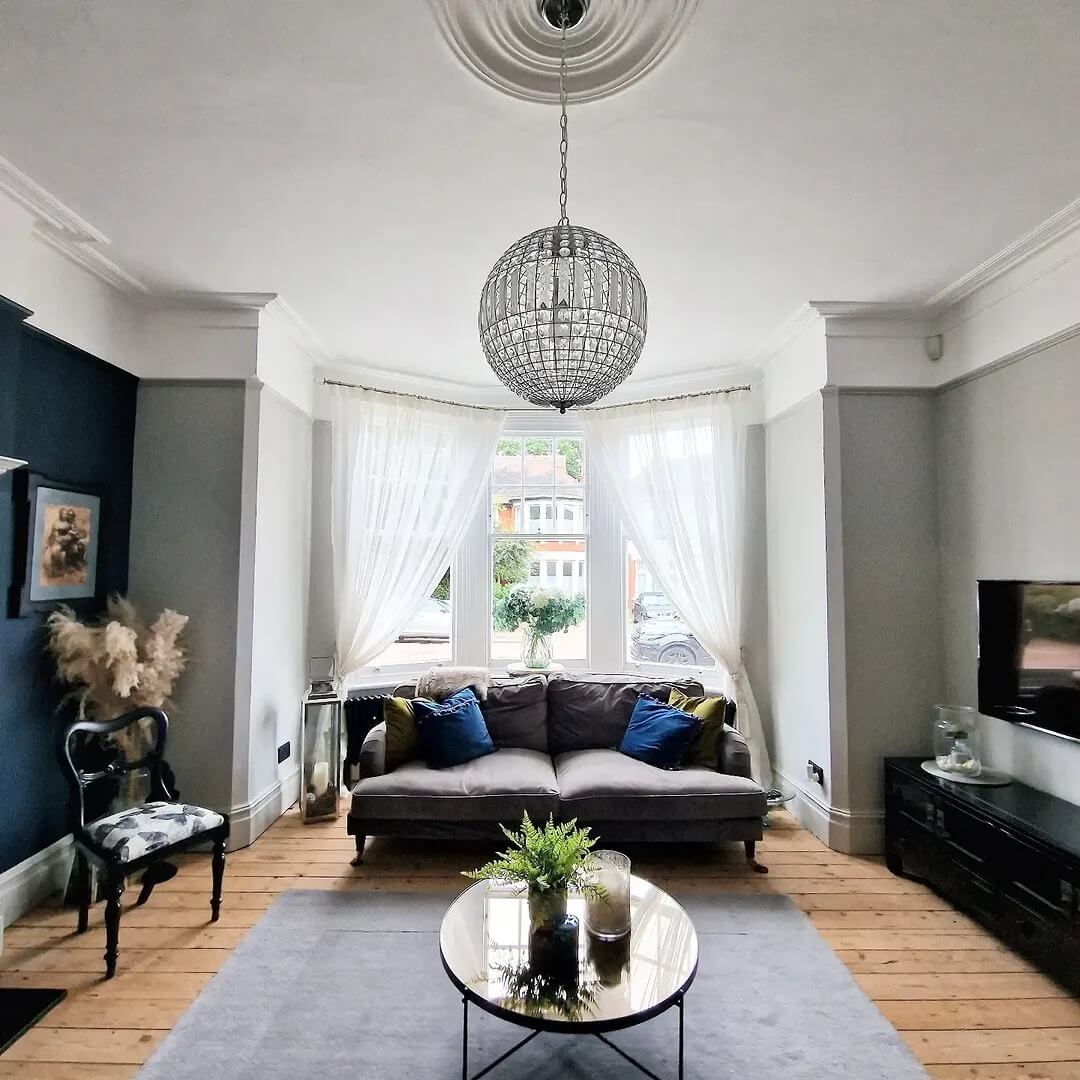 Ornate Crystal Globe Chandelier Adds Sparkle to a Neutral Room