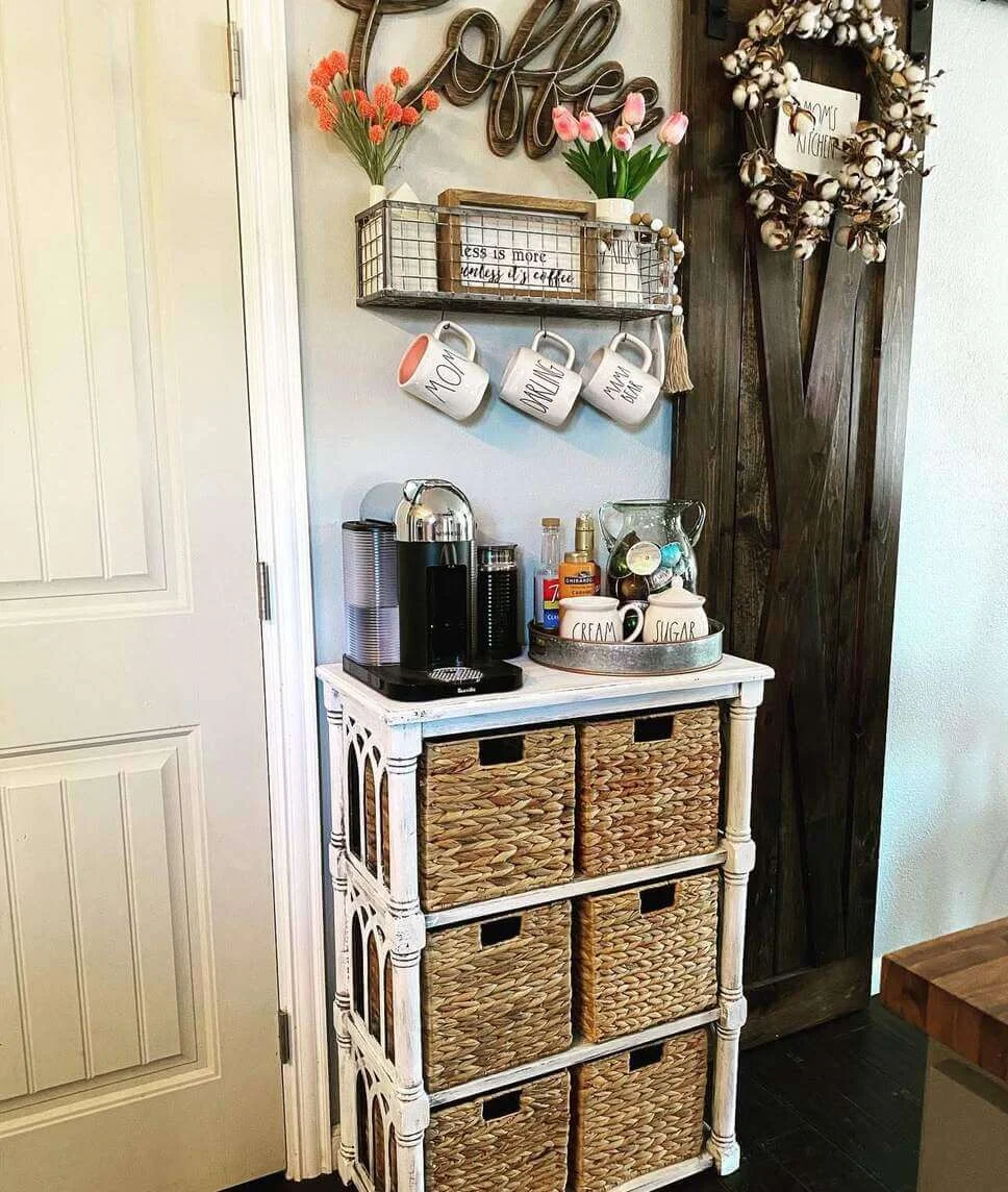 Distressed White Cabinet with Woven Baskets Hides Coffee Supplies