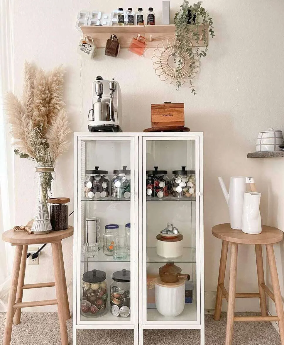 Glass-Fronted Cabinet Displays Coffee Pods and Accessories