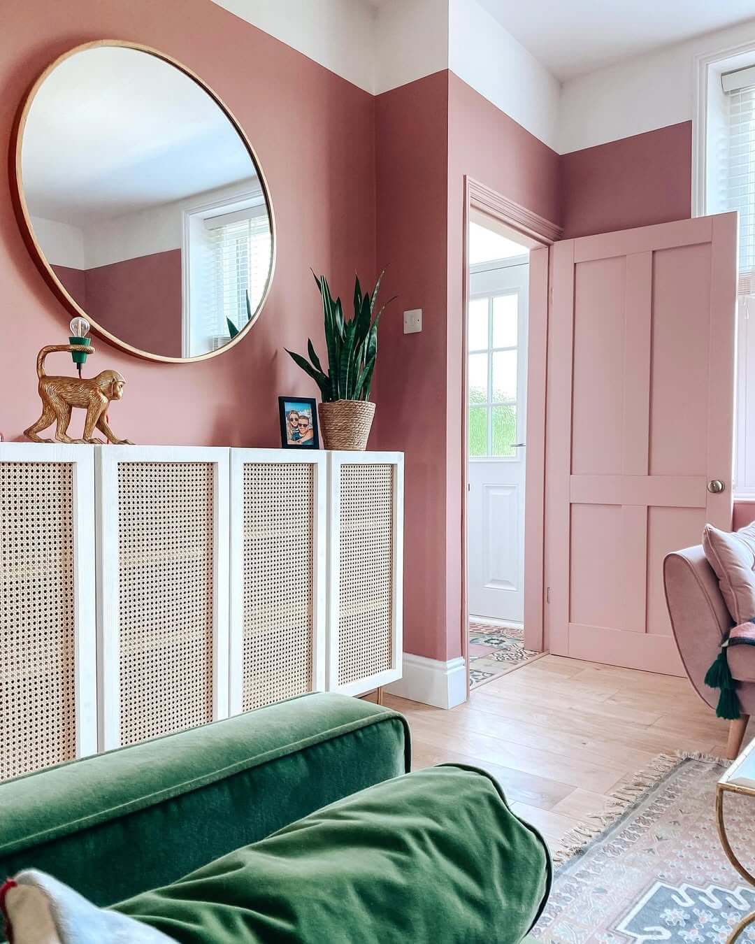 Cane-Fronted Cabinet Adds Natural Texture to Pink Room