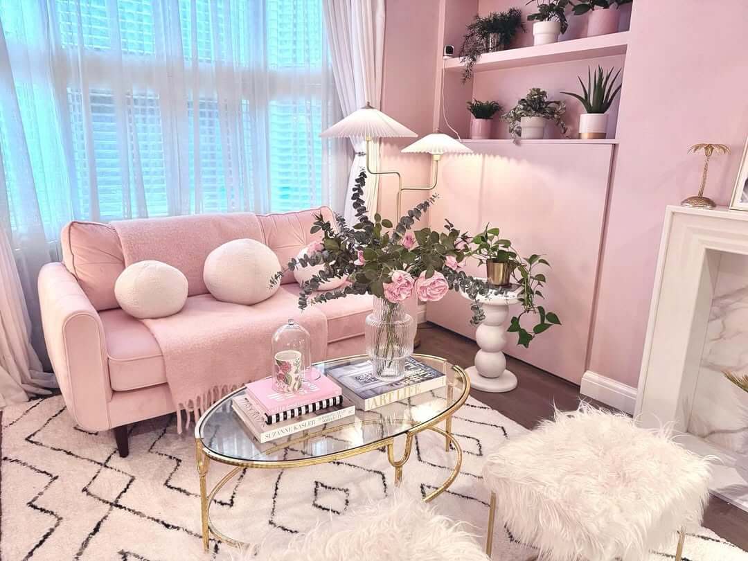 Glass and Gold Coffee Table Displays Stacked Books and Flowers