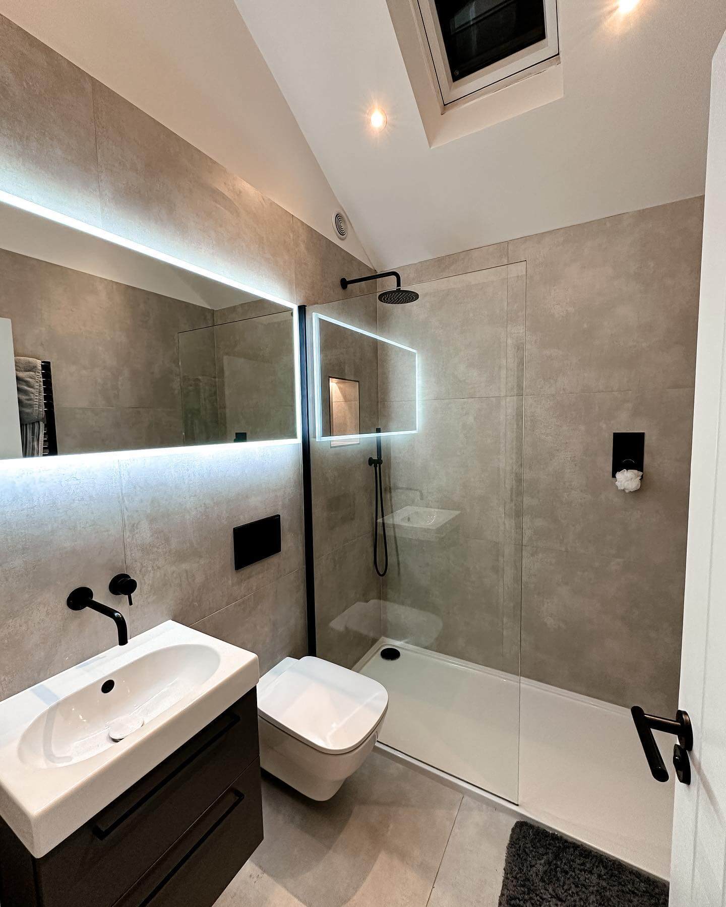 Recessed Mirror Lighting Frames the Vanity