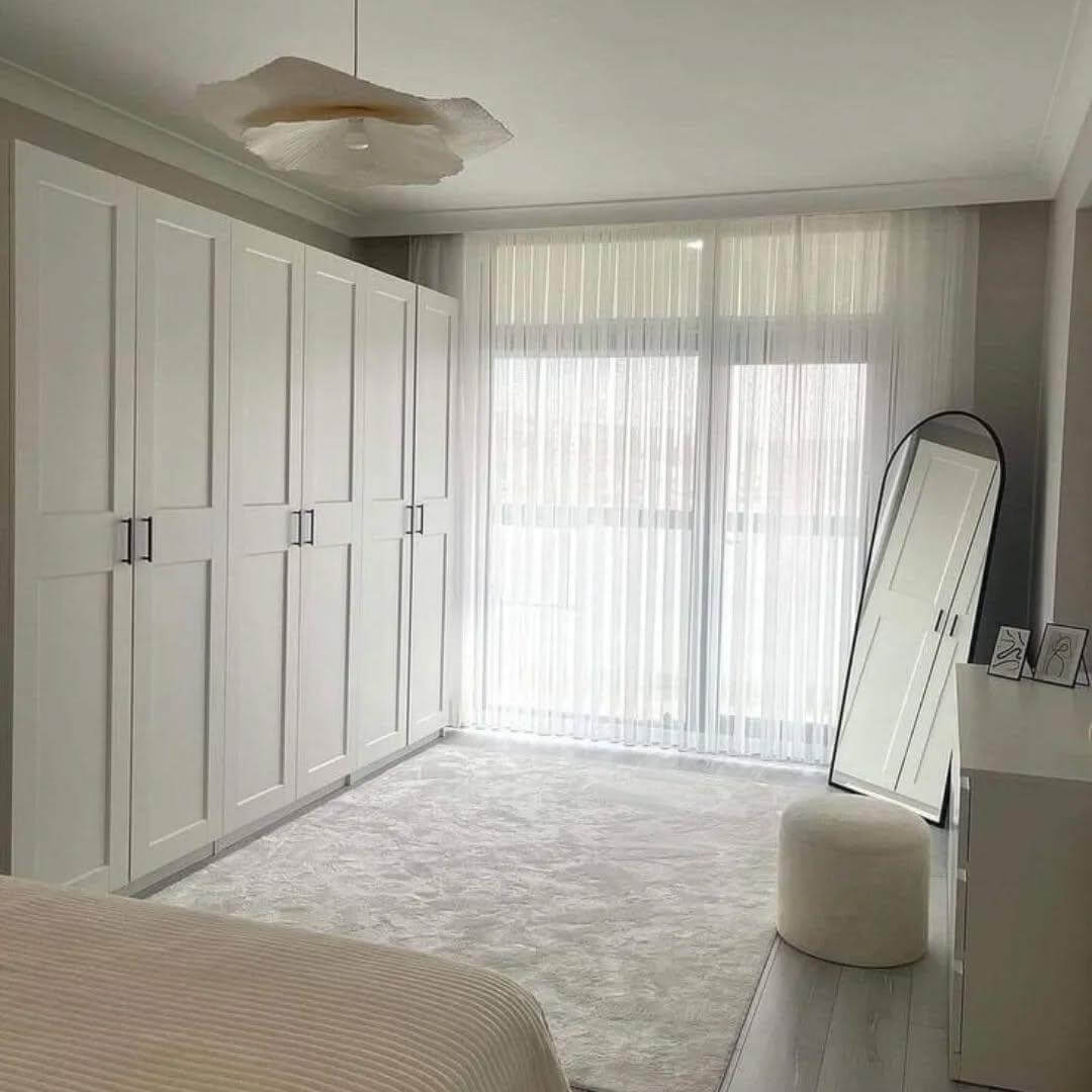 Lean an Arched Mirror With a Minimalist Black Frame