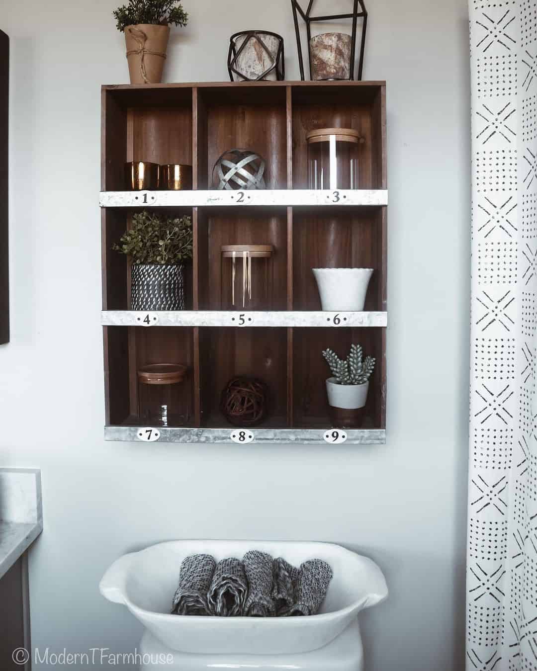 Divided Wall Shelf Organizes Small Bathroom Items