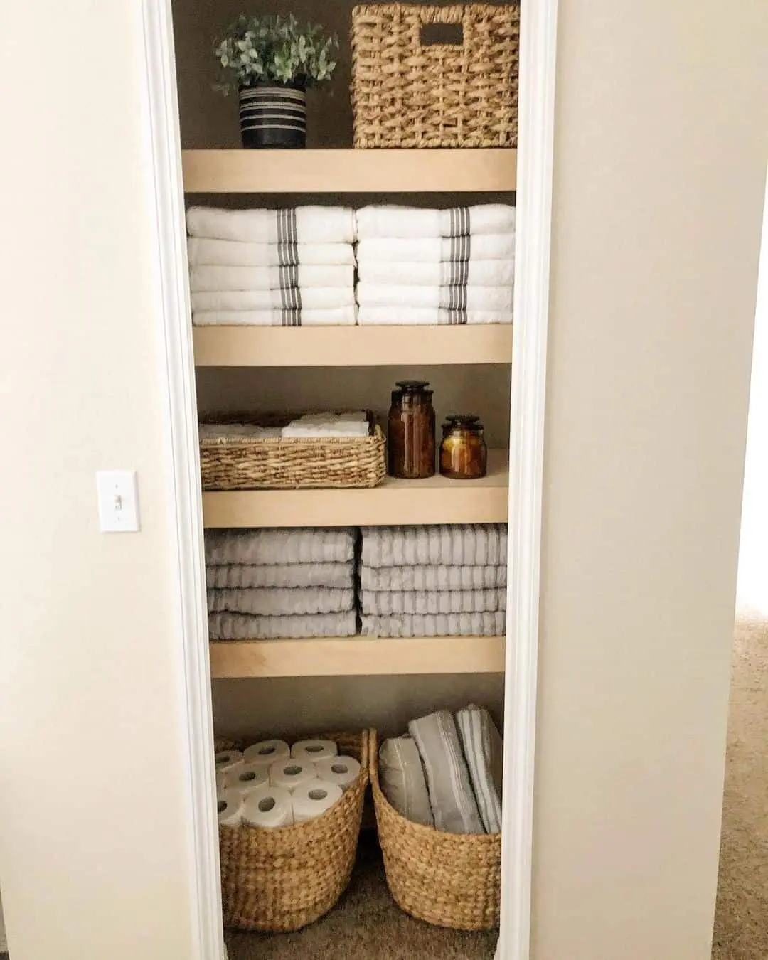 Woven Baskets Corral Bulk Toilet Paper and Linens