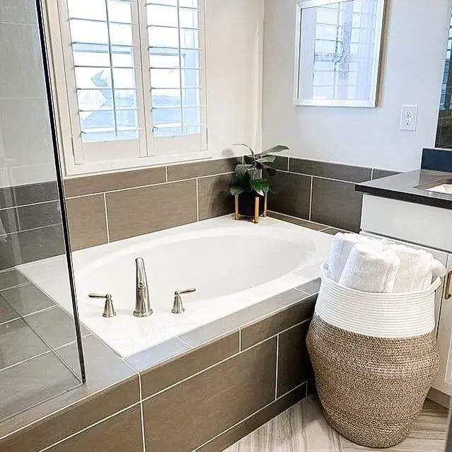 Woven Rope Basket Holds Folded Towels Near Tub