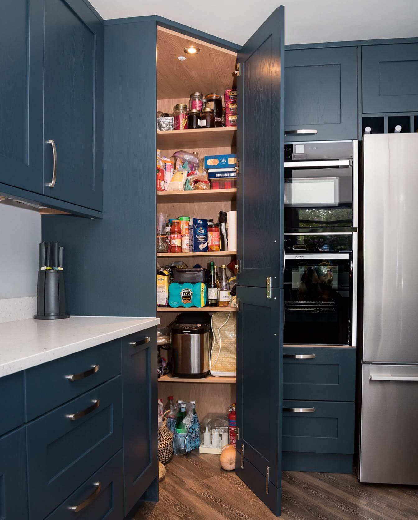 Deep Cabinet Shelves Hold Tall Bottles and Bulky Appliances