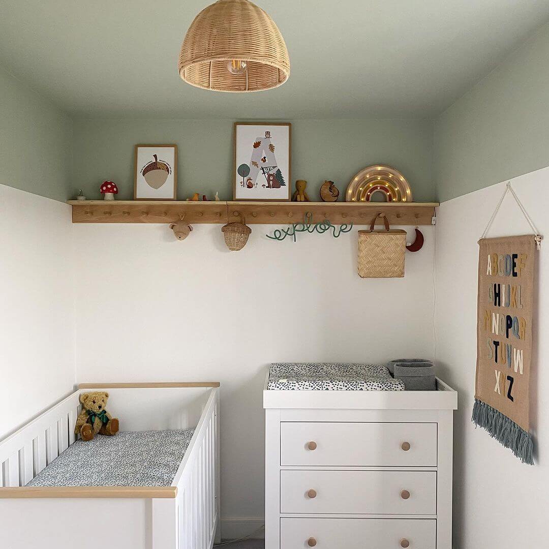 Wooden Peg Rail Displays Whimsical Wall Art and Small Baskets