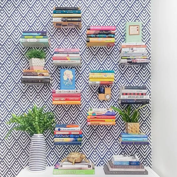 Floating Shelves Display Books Beside a Patterned Wall