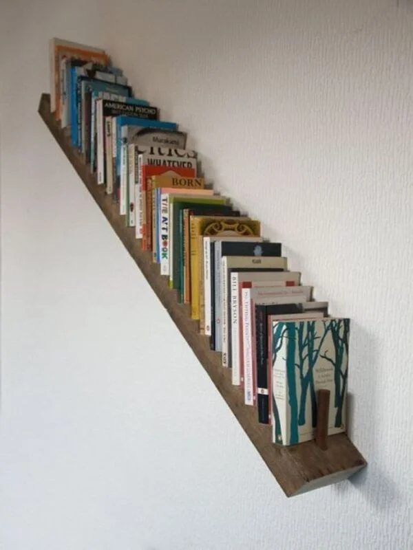 Slanted Wooden Ledge Holds Books Like Stair Steps