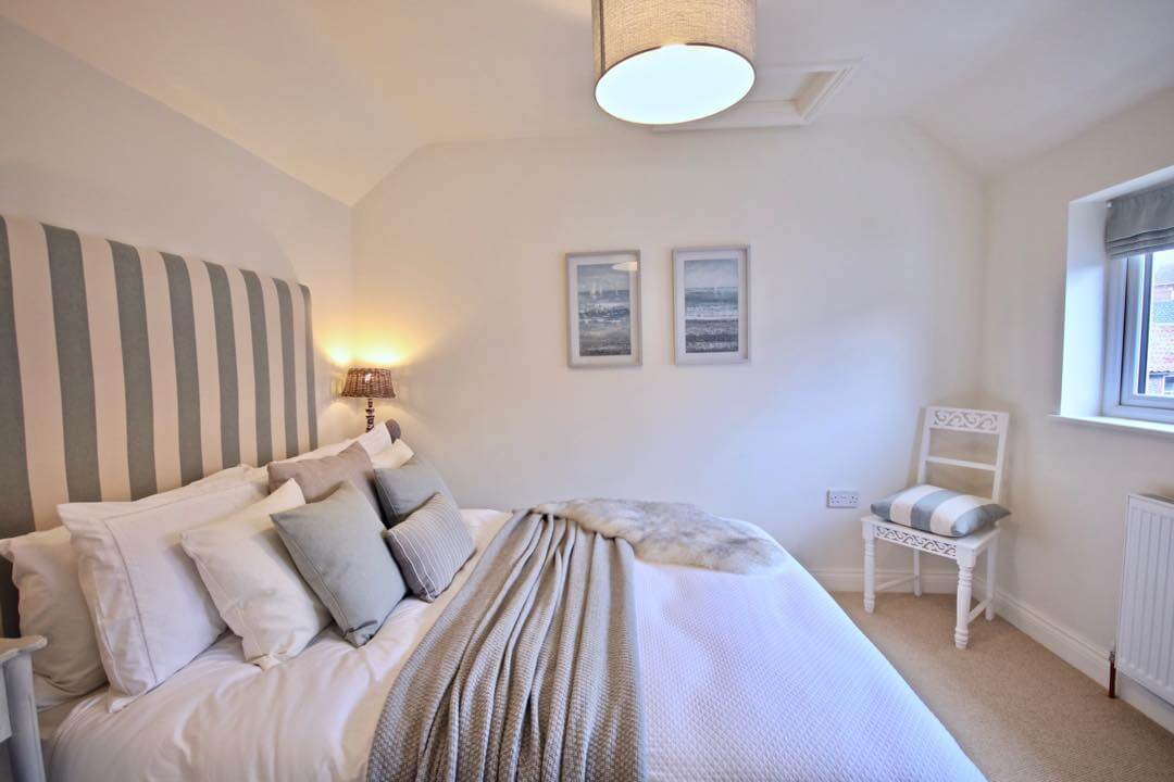 Striped Headboard Adds a Soft Vertical Element