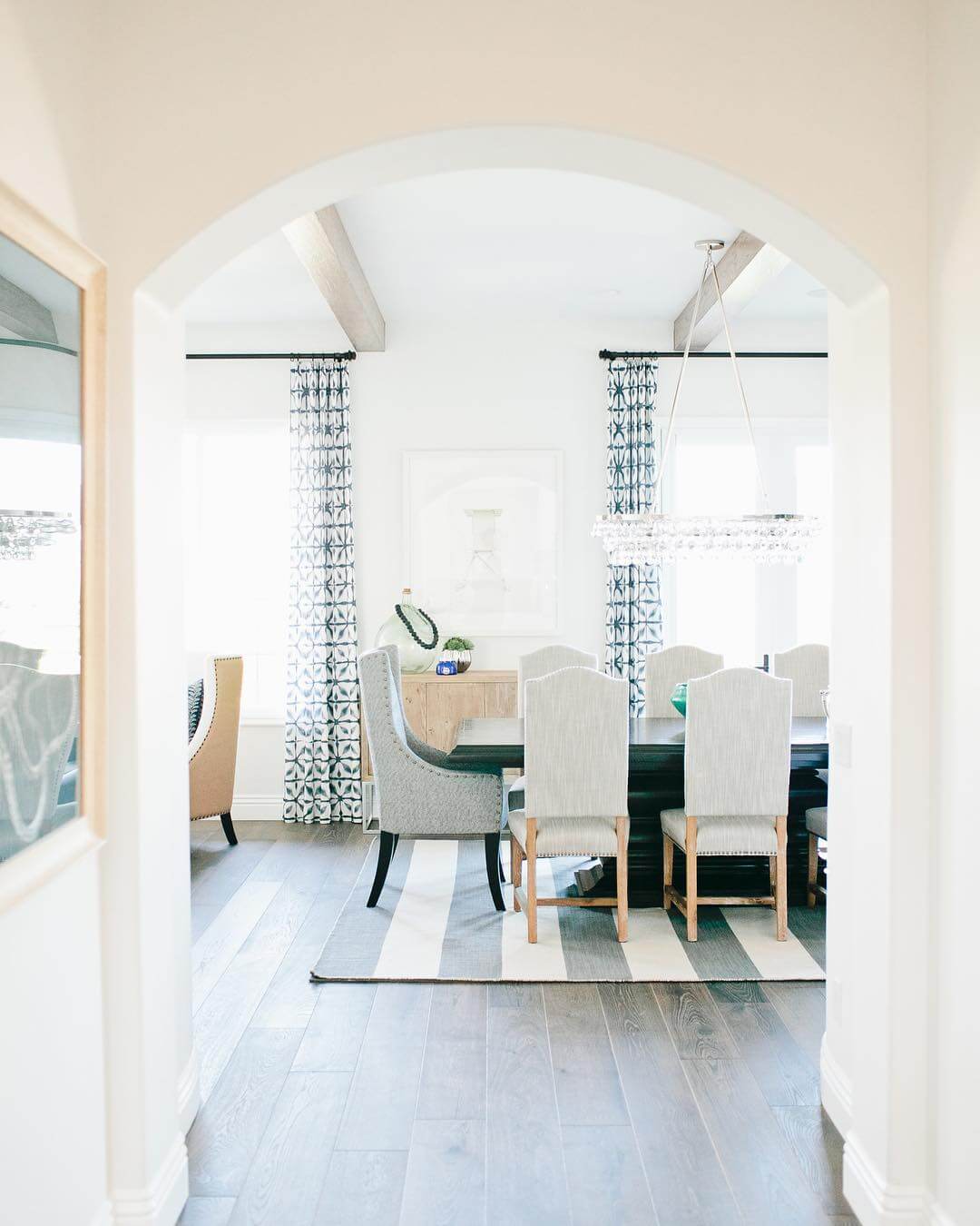 Graphic Striped Rug Anchors the Dining Area