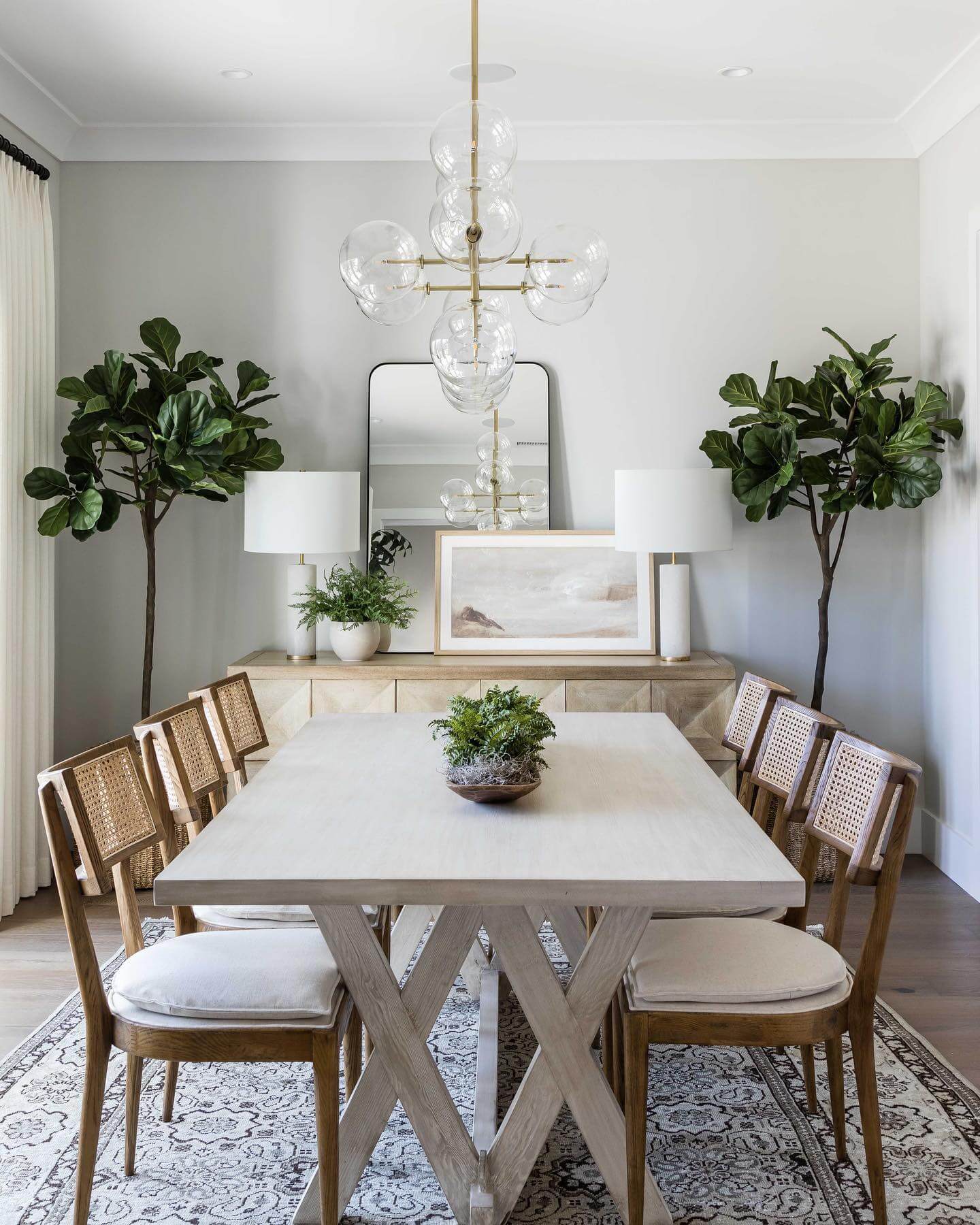 Tall Fiddle Leaf Figs Flank the Dining Area