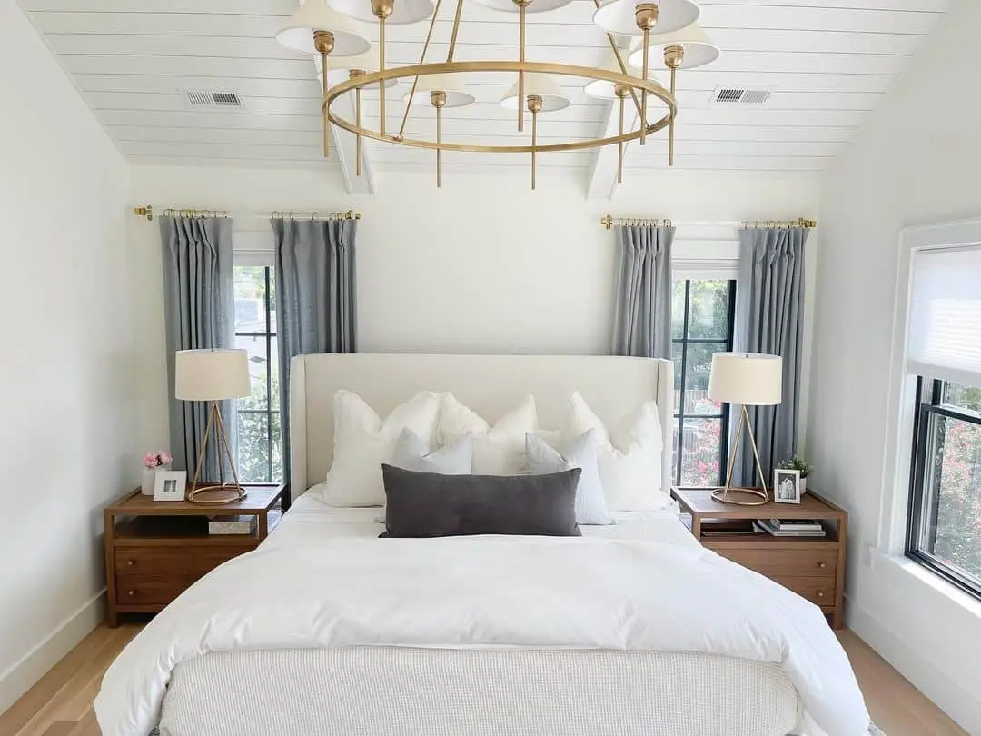 White Shiplap Ceiling Adds Airy Height to Coastal Bedroom