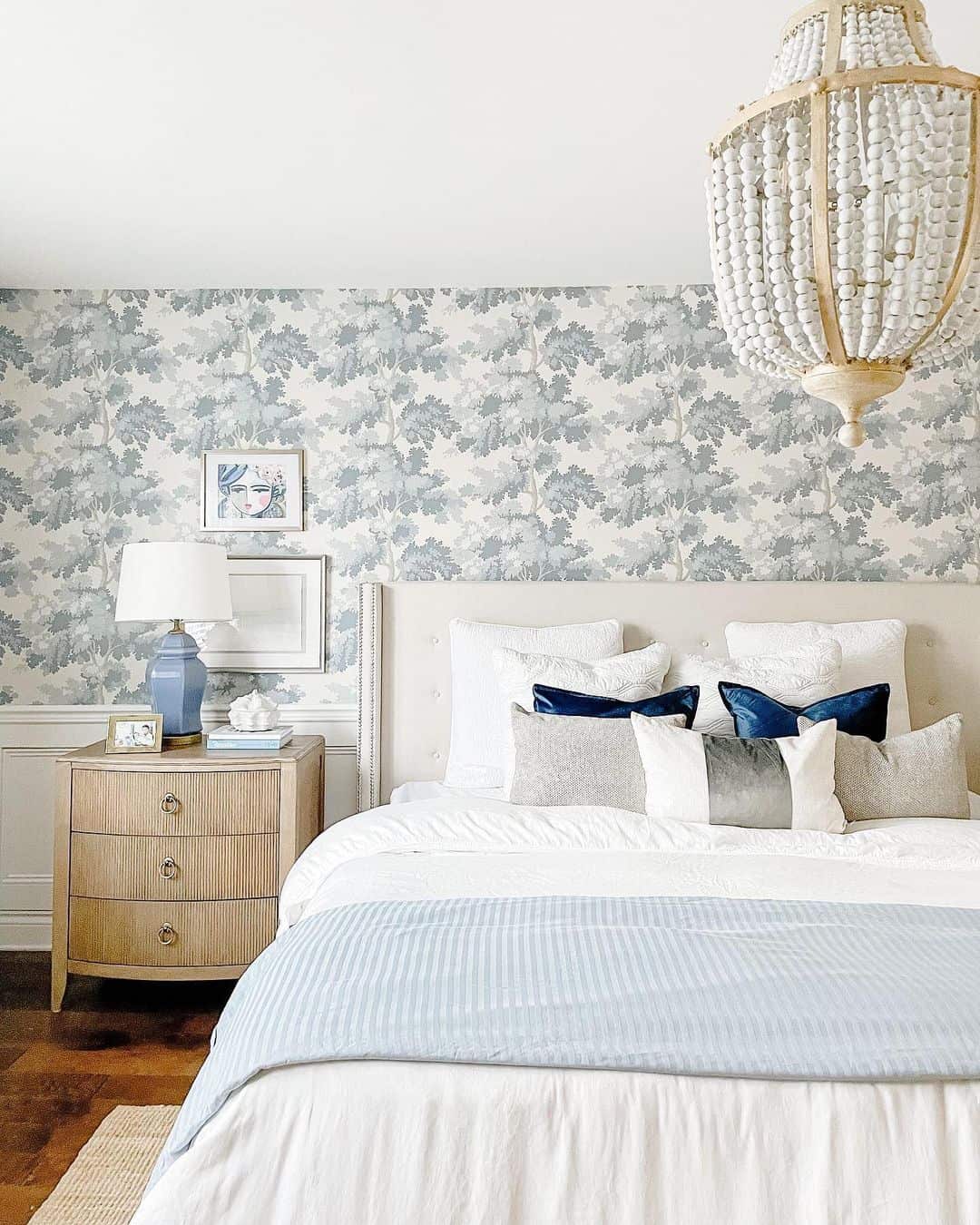 Patterned Wallpaper Creates a Coastal Tree Canopy Backdrop