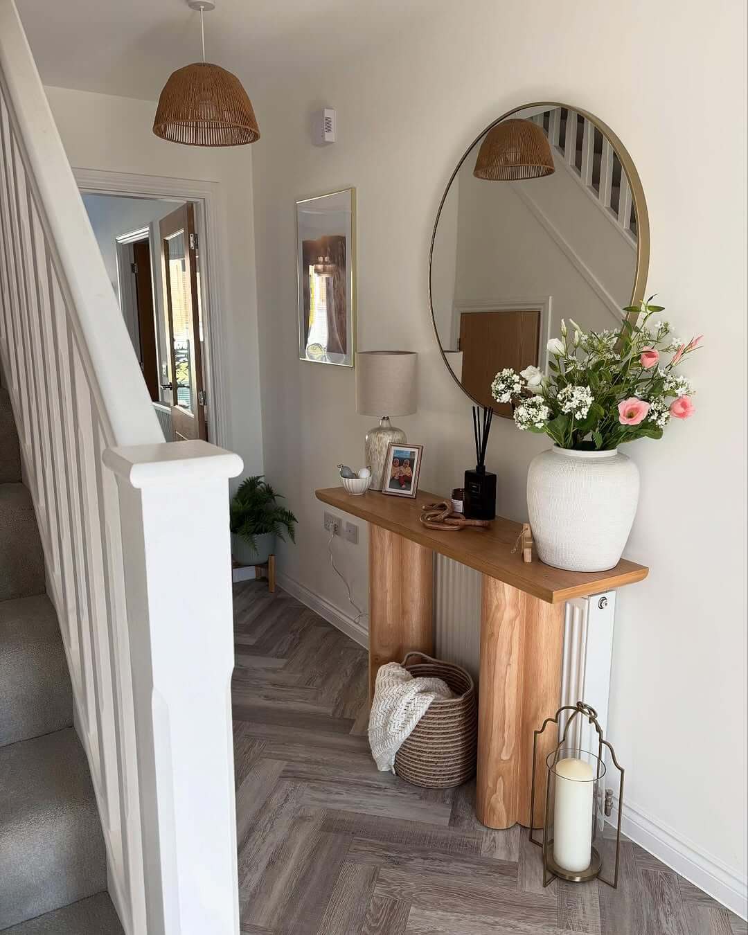 Round mirror reflects light and adds depth