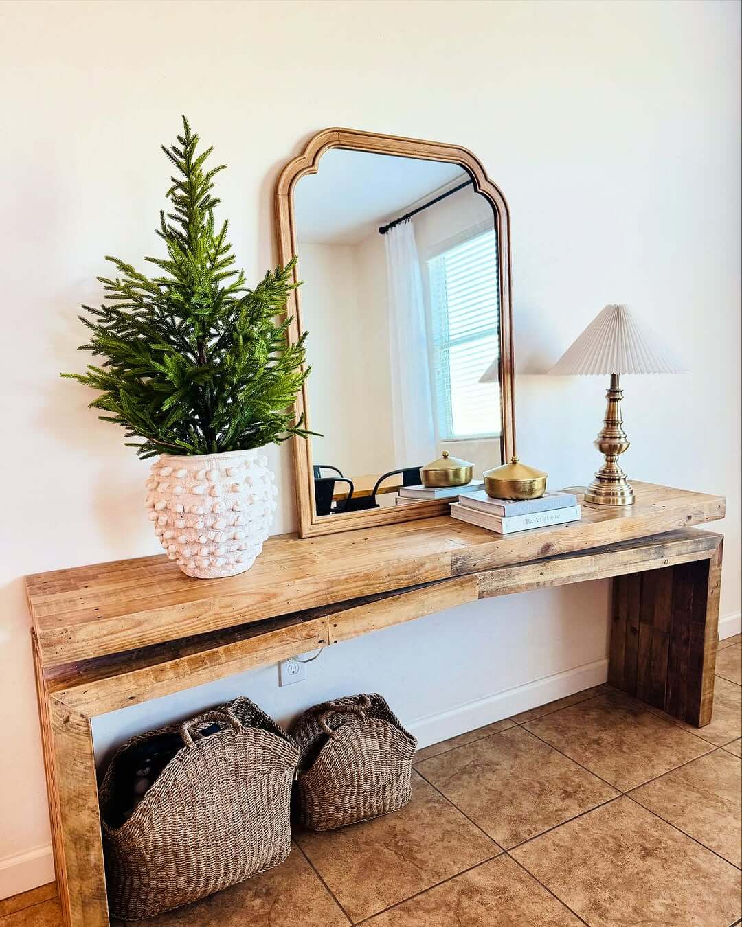 Textured White Planter Holds a Full Evergreen