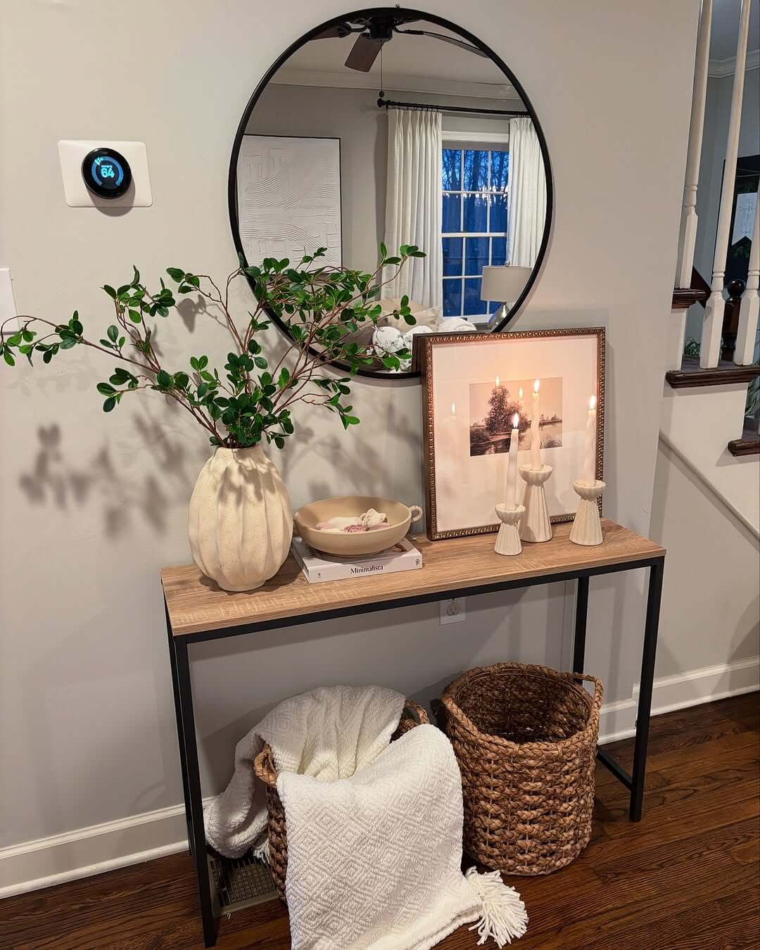 Layer Candlesticks for Warmth in Front of Artwork
