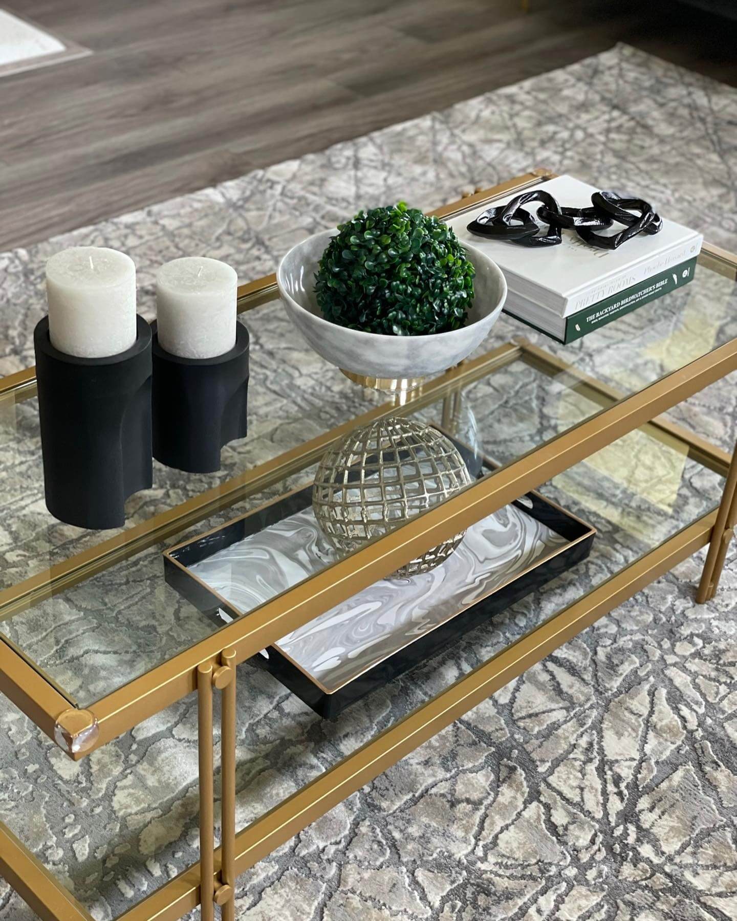 Introduce Shine with a Geometric Metal Sphere on a Marble Tray