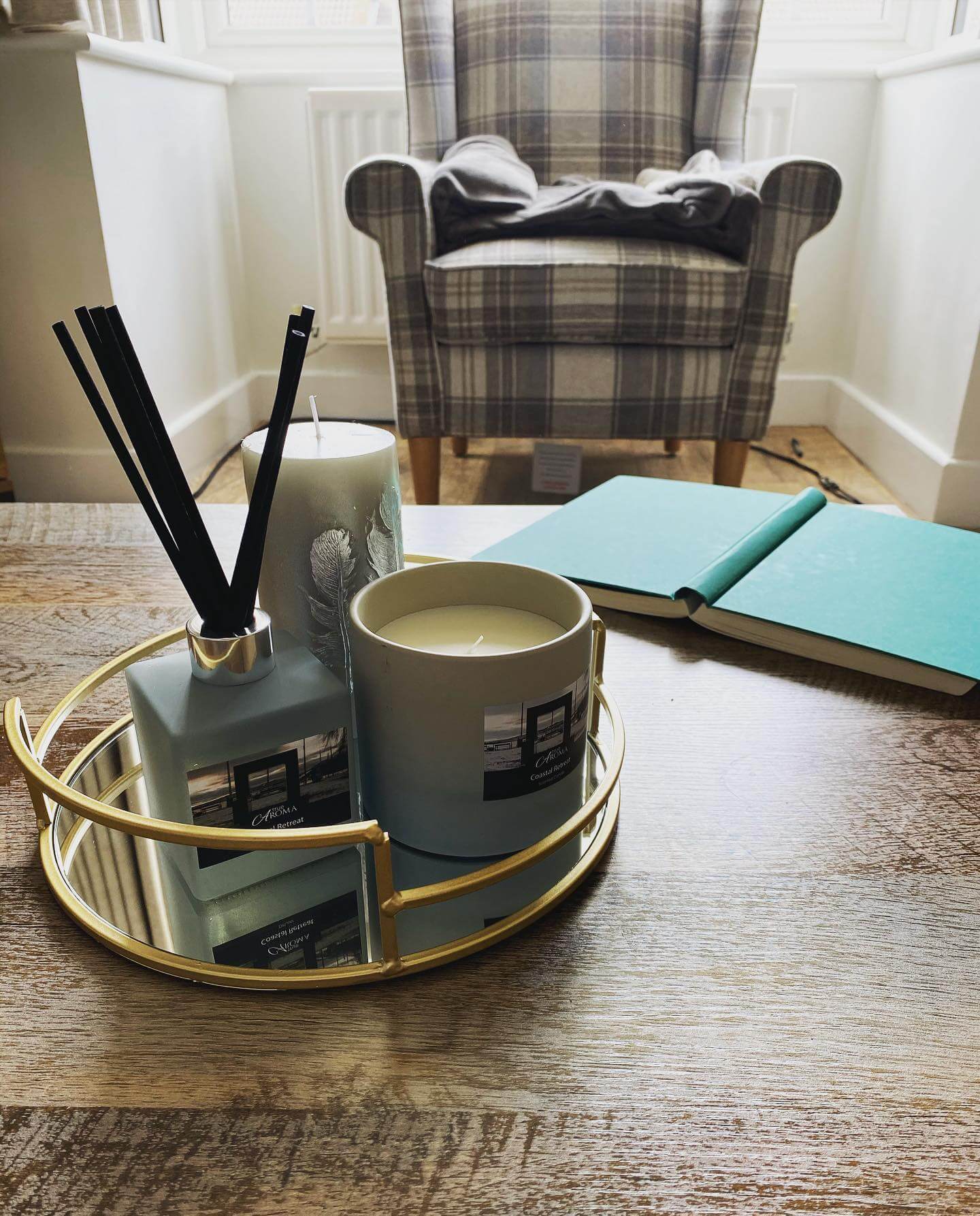 Gold Tray Reflects Aromatic Candle and Diffuser