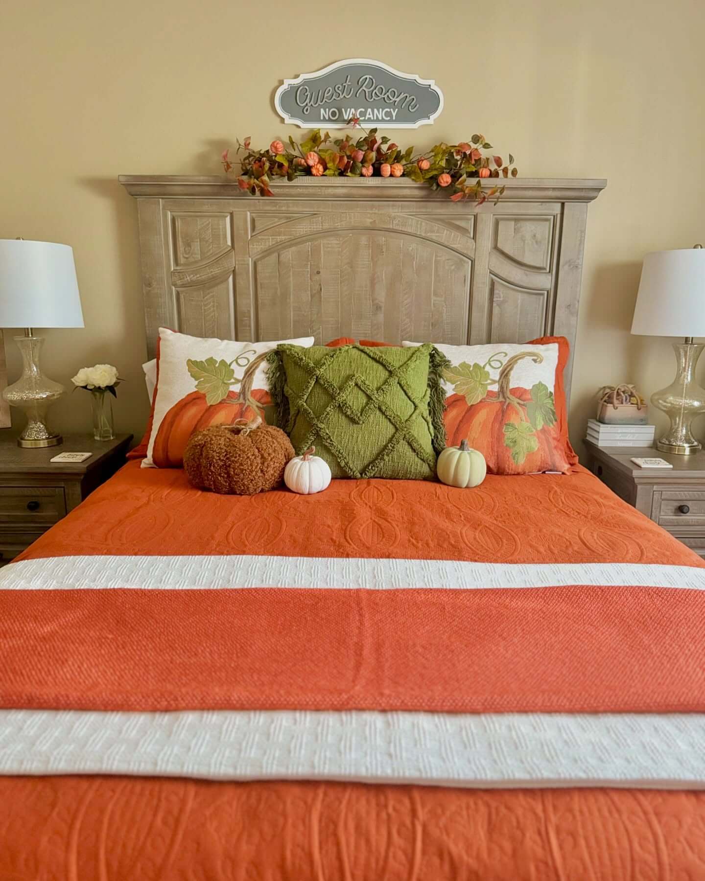 Layered Orange and White Bedding for a Cozy Fall Feel