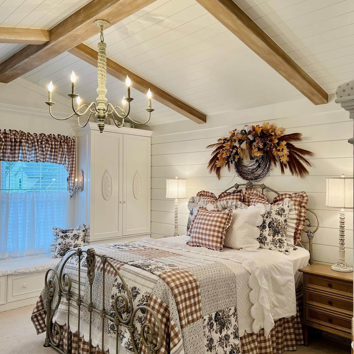 Large Fall Wreath Adds Seasonal Texture Above the Bed