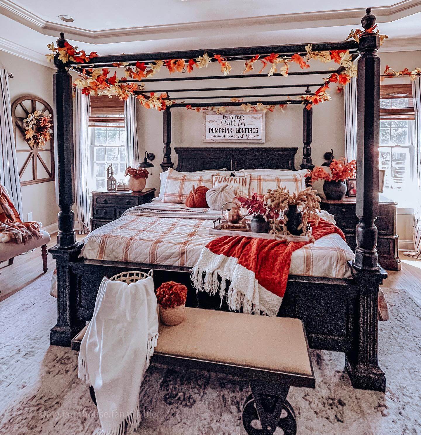 Fall leaf garland adds seasonal color to canopy bed posts