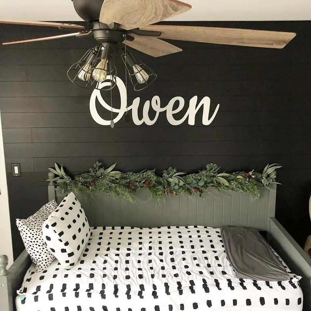 Personalized White Name Sign Above a Daybed