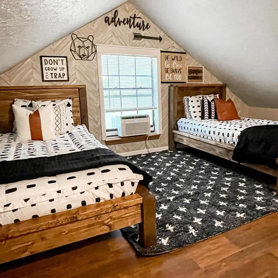 Wood Headboards Frame a Cozy Bedroom With Adventure-Themed Wall Art