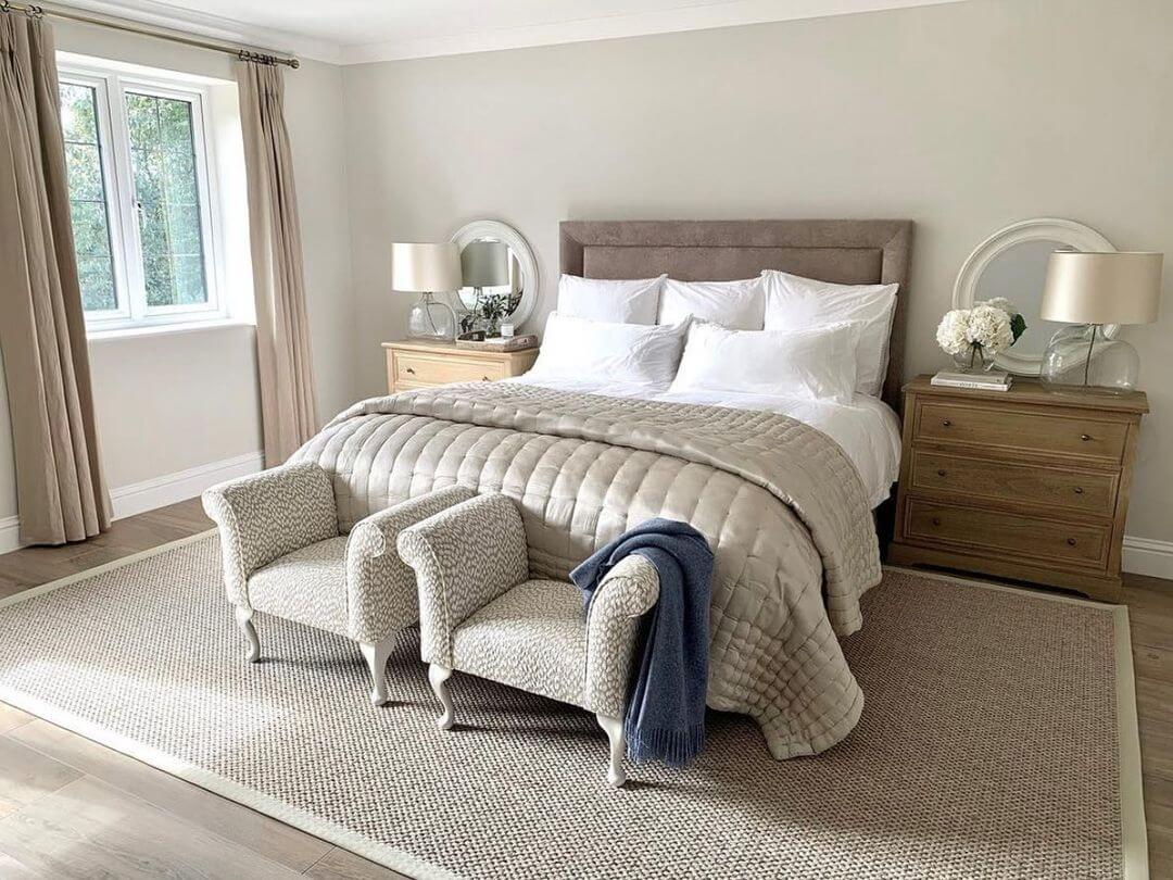 Petite Armchairs Create a Cozy Nook at the Foot of the Bed