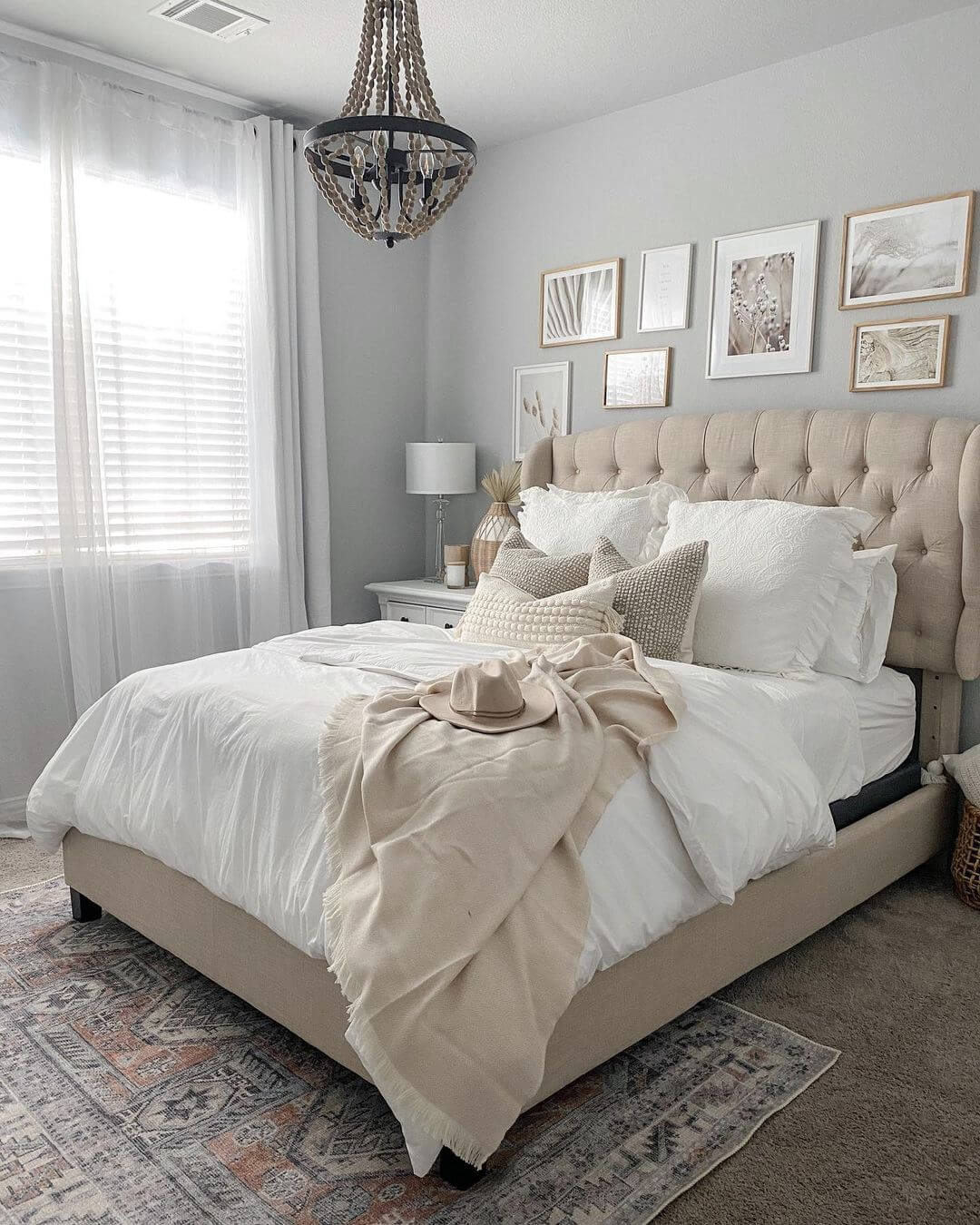 Gallery Wall Mixes Framed Prints Above Tufted Headboard